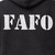Close-up detail of high-visibility reflective FAFO graphic on black motorcycle sweatshirt