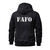 Back view of FAFO reflective biker hoodie glowing bright white under headlights during night ride