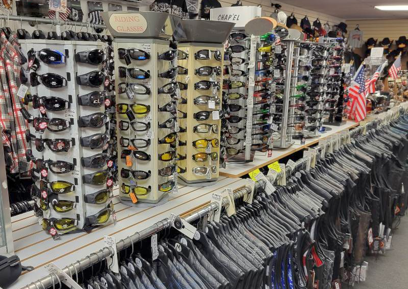 Display of padded motorcycle riding glasses and biker sunglasses at Leather Bound NJ