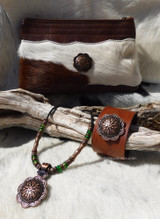 Sunburst Berry Western Leathercraft Concho on a Leather Cell Phone Bag, Bracelet, and Necklace.
