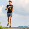 Man running wearing US Army Veteran Graphic T-Shirt with New Army Logo