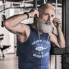 Vietnam Veteran Sleeveless Shirt with Frequent Flyer Text and Huey Graphic in navy blue on man adjusting headphones in the gym