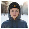 Woman wearing Beanie with Armor Of God Embroidered Patch out in the snow