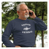 man on the phone wearing Vietnam Veteran Huey navy Long Sleeve T-Shirt with White Vietnam Veteran Text and Black Huey Design