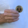 man holding officially licensed by u s army challenge coin big red one