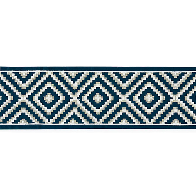 Medina Embroidered Tape Indigo by Scalamandre
 Trim Scalamandre
 Trim Medina Embroidered Tape IndigoTrim LA BOHEME 55% COTTON 37% VISCOSE 8% SPUN POLYESTER INDIA </p><p>Repeat: H: 5", V: 5.5" - Fabric Carolina -