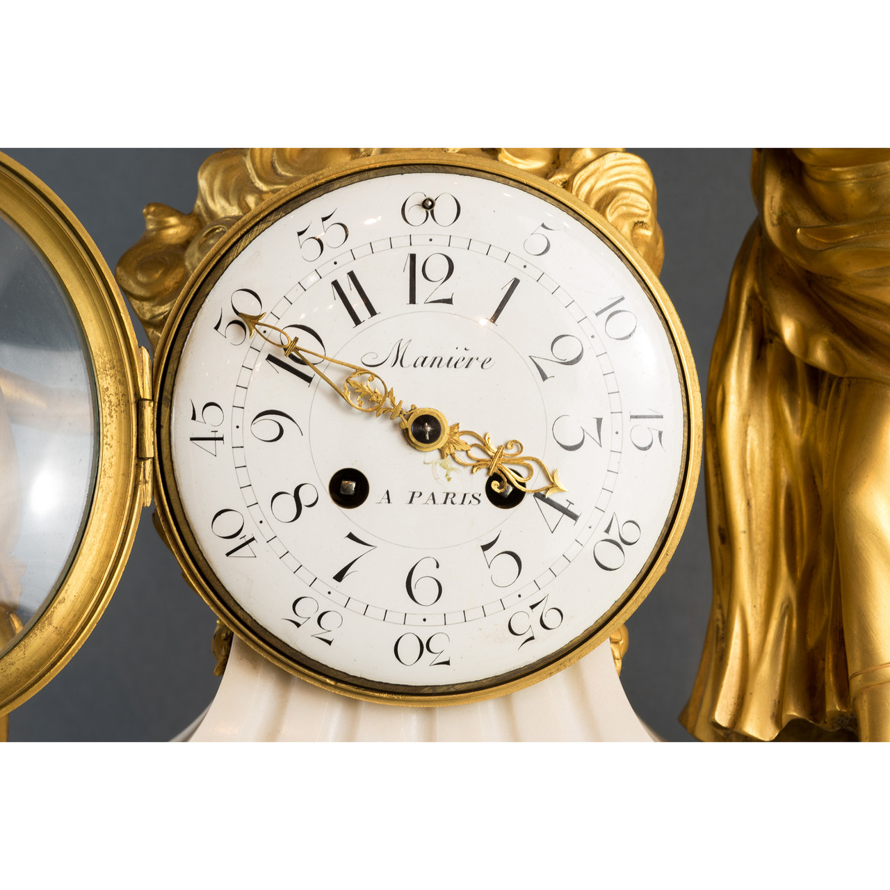 A Fine Gilt Bronze and Marble Mantel Clock with Putti by Maniere