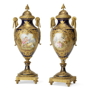 A Fine Quality Pair of Sèvres-Stye Gilt Bronze-Mounted Porcelain Urns A Fine Quality Pair of Sèvres-Stye Gilt Bronze-Mounted Porcelain Urns