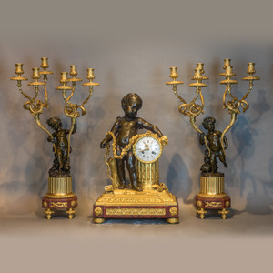 A Fine 19th Century Ormolu and Patinated Bronze Clock Set Garniture A Fine 19th Century Ormolu and Patinated Bronze Clock Set Garniture