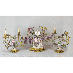 A Fine French Gilt-Bronze and Porcelain Clockset with figural group and porcelain flowers A Fine French Gilt-Bronze and Porcelain Clockset with figural group and porcelain flowers