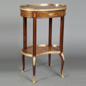 A Stunning Louis XV-Style Ormolu-Mounted Inlaid Tulipwood and Mahogany Galleried Oval Top Table A Stunning Louis XV-Style Ormolu-Mounted Inlaid Tulipwood and Mahogany Galleried Oval Top Table