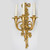 A Symbolic and Distinguished Pair of Louis XVI Style Three-Light Gilt Bronze Wall Sconces  A Symbolic and Distinguished Pair of Louis XVI Style Three-Light Gilt Bronze Wall Sconces