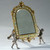 A Fine Champlevé Enamel and Gilt Bronze Vanity Mirror Held by Cherubs