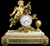 A Louis XVI Ormolu and White Marble Mantel Clock of Cupid