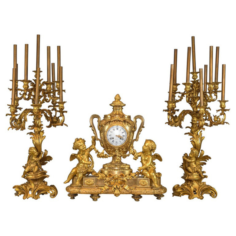 An Important Monumental Gilt Bronze Clockset with Putti Playing with Flower Garlands