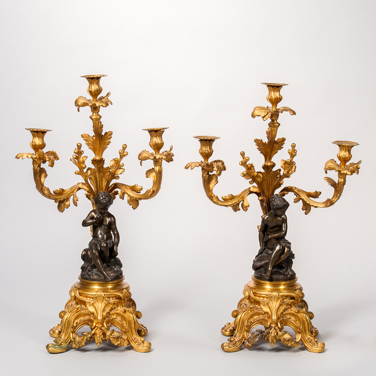 Pair of Patinated and Gilt Bronze Figural Three-Light Candlesticks