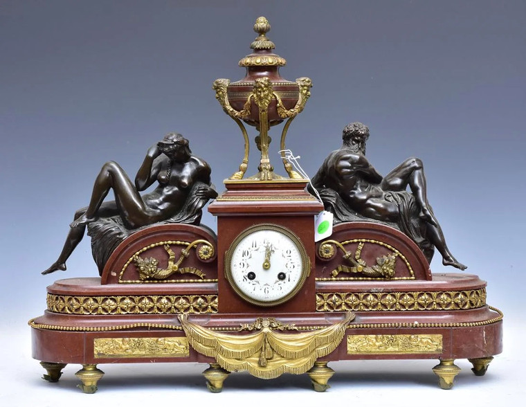 A Tiffany & Co. Gilt Bronze and Rouge Marble Mantel Clock