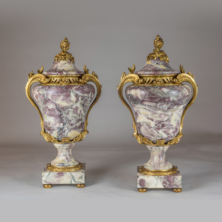 A Pair of Fine Quality Louis XV Ormolu-Mounted Sarrancolin Marble Urn and Cover.