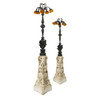 Pair of carved marble and patinated bronze floor lamps