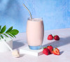 Herbalife Formula 1 Nutritional Shake Mix Strawberry Delight (550g). Glass of shake.