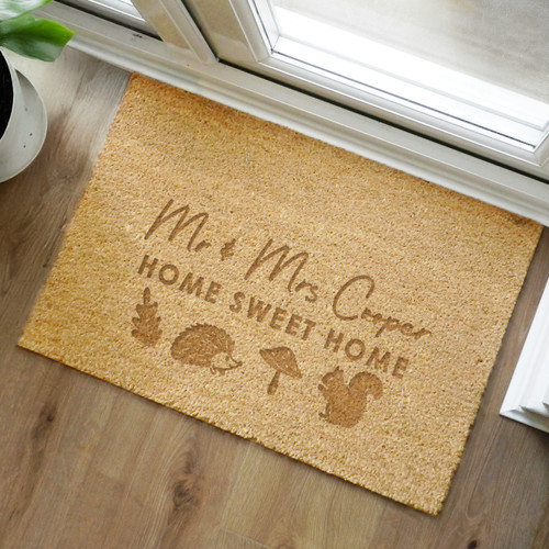 Welcome guests this Autumn with our Personalised Pumpkin Rectangle Moon Doormat!
Made from natural coir fibres, this seasonal essential is perfect for adding a festive touch to your doorstep.

Personalise with 2 lines ot text, each containing up to 20 characters.

The personalisation on line 1 is case sensitive and appear as entered. Please refrain from using fixed upper case on this line as this could make the script font difficult to read.
All other personalisation will appear in fixed UPPERCASE.

Please note, these doormats are designed for INDOOR use only and will last longer if they are protected from the rain.

Dimensions 60cm x 40cm x 1.5cm
Wipe clean only

Ideal for New Home, Autumn & Halloween