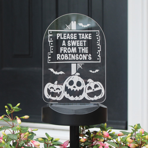 This spooky personalised solar light is the ideal Halloween decoration!

Perfect for indoor or outdoor use.

The light can be personalised with a message over 4 lines, each containing up to 12 characters.

The personalisation will appear in fixed uppercase.

Sign - Height 19cm / Width 13.5 cm / Depth 0.3 cm
Ground stick and solar panel base - Height 34cm / Width 14 cm / Depth 9 cm

Installation (2 options)
A. Connect the solar lamp base to the ground rod, and push into the ground/pot where you would like it.
B. Drill two holes on the wall, insert the screws and hang up the solar light. (Screws included)

Peel off the protective film from the solar panel. Press and hold the button for 5 seconds on the bottom of the LED light to turn it on (note - cover the solar panel with your hand to test if it is on. Please note the item will not solar charge if it is not turned on.

No batteries or wires required, just ensure the solar panel light is placed in a sunny light environment.

Short press the button to change the colour mode and light mode. The colour and light modes are below.
White, red, green, blue, orange, light blue, purple, flashing, strobe, fading and smooth.

Ideal for Halloween
