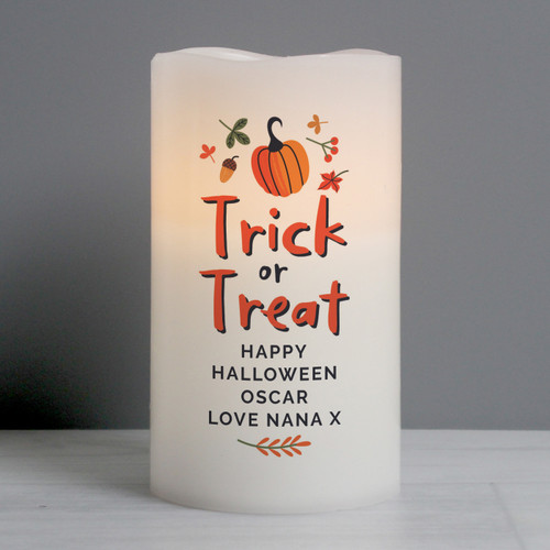 This beautiful and safe Personalised Trick or Treat LED Candle is the perfect addition to your Halloween Decorations

Personalise this candle with up to 4 Lines of Personalisation

Line 1 - 15 Characters
Line 2 - 15 Characters
Line 3 - 15 Characters
Line 4 - 15 Characters

'Trick or Treat' is fixed Text and cannot be changed.

All personalisation is in upper case

The LED candle has a flame effect and is coated in real wax. Concealed at its base is the housing for the batteries.

The candle is presented in an organza bag.

The candle takes 3 x AAA batteries (not included).

Ideal for Halloween