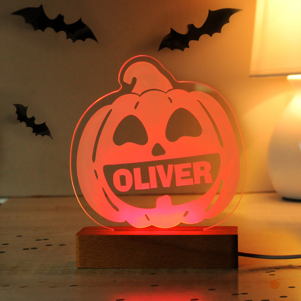 This personalised pumpkin LED light if perfect for Halloween!

You can personalise this LED light with a name up to 12 characters long.

Please note that all personalisation will appear in fixed upper case.

Sign - Height 13 cm / Width 13.5 cm / Depth 0.3 cm
Base - Height 2.5 cm / Width 12 cm / Depth 4.5 cm

The LED light is operated by USB cable.

The light is colour changing and can be changed using the control pad.

The selectable colour options available are Red, Green, Blue, Pink, Yellow, Light Blue, White.

These can be set to change constantly or have one specific colour. You can also control the brightness.

Perfect for Halloween!