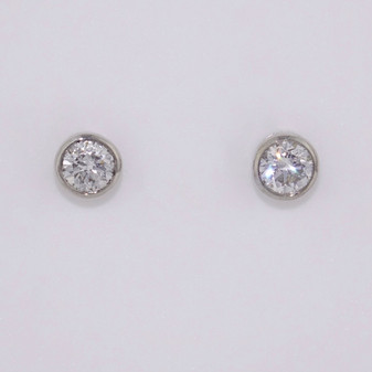 9ct white gold diamond solitaire stud earrings in rubover settings