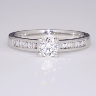 18ct white gold diamond solitaire ring with channel-set baguette cut diamond shoulders GR3788