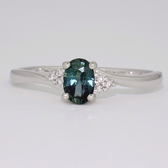 Platinum teal sapphire and diamond twist ring