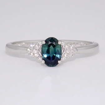 Platinum oval cut teal sapphire and diamond ring