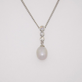 18ct white gold Scottish freshwater pearl and three rubover-set diamond pendant