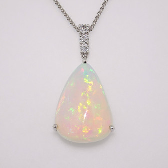 Unique 9ct white gold pear cabochon cut Ethiopian water opal and three graduated round brilliant cut diamond pendant