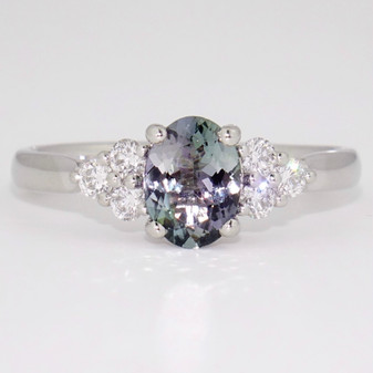 Platinum oval cut mermaid tanzanite and round brilliant cut diamond ring