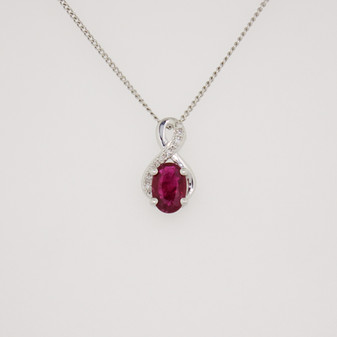 9ct white gold oval cut ruby and diamond swirl pendant
