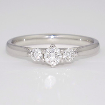 Platinum round brilliant cut diamond trilogy ring