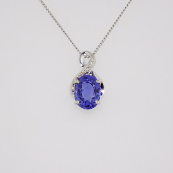 9ct white gold oval cut Ceylon sapphire and diamond swirl pendant