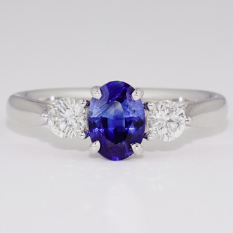 Platinum oval cut sapphire and round brilliant cut diamond ring