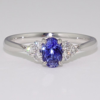 Platinum oval cut sapphire and round brilliant cut diamond ring