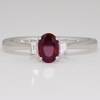 Platinum oval cut ruby and baguette cut diamond ring