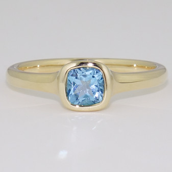 9ct gold cushion cut blue topaz rubover ring