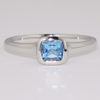 9ct white gold cushion cut blue topaz rubover ring