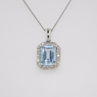 18ct white gold emerald cut aquamarine and diamond halo pendant