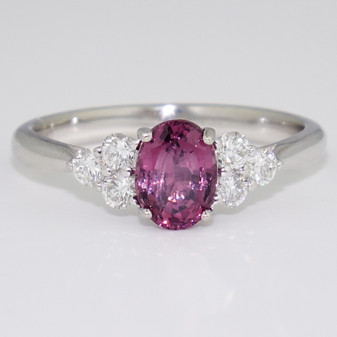 Platinum oval cut spinel and round brilliant cut diamond ring