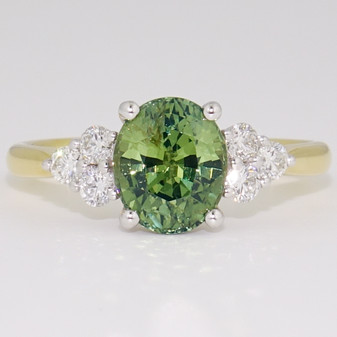 18ct gold and platinum oval cut green sapphire and round brilliant cut diamond ring