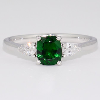 Platinum cushion cut unheated tsavorite and pear cut diamond ring