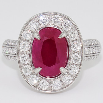 Platinum GIA certificated unheated Burmese oval cut ruby and diamond halo ring with diamond-set shoulders and secret heart detail