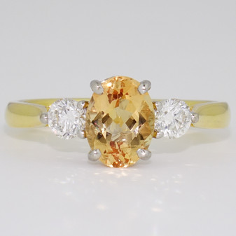 18ct gold oval cut Imperial topaz and round brilliant cut diamond ring