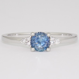 Platinum round cut aquamarine and round brilliant cut diamond ring